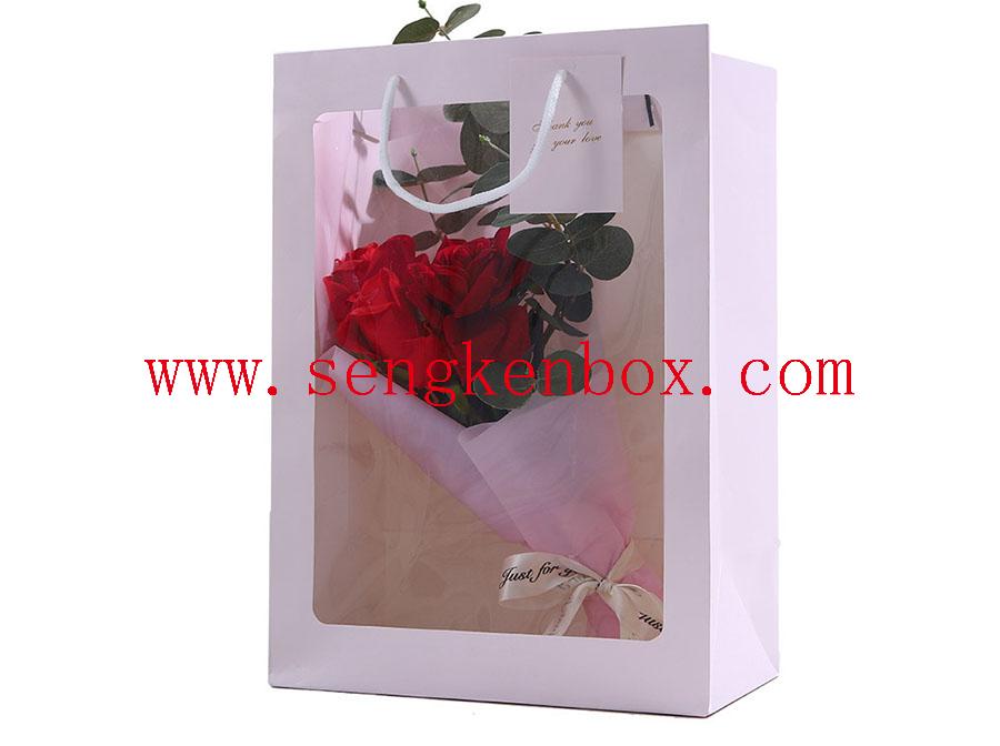 Bolsa de papel de regalo de flores transparentes