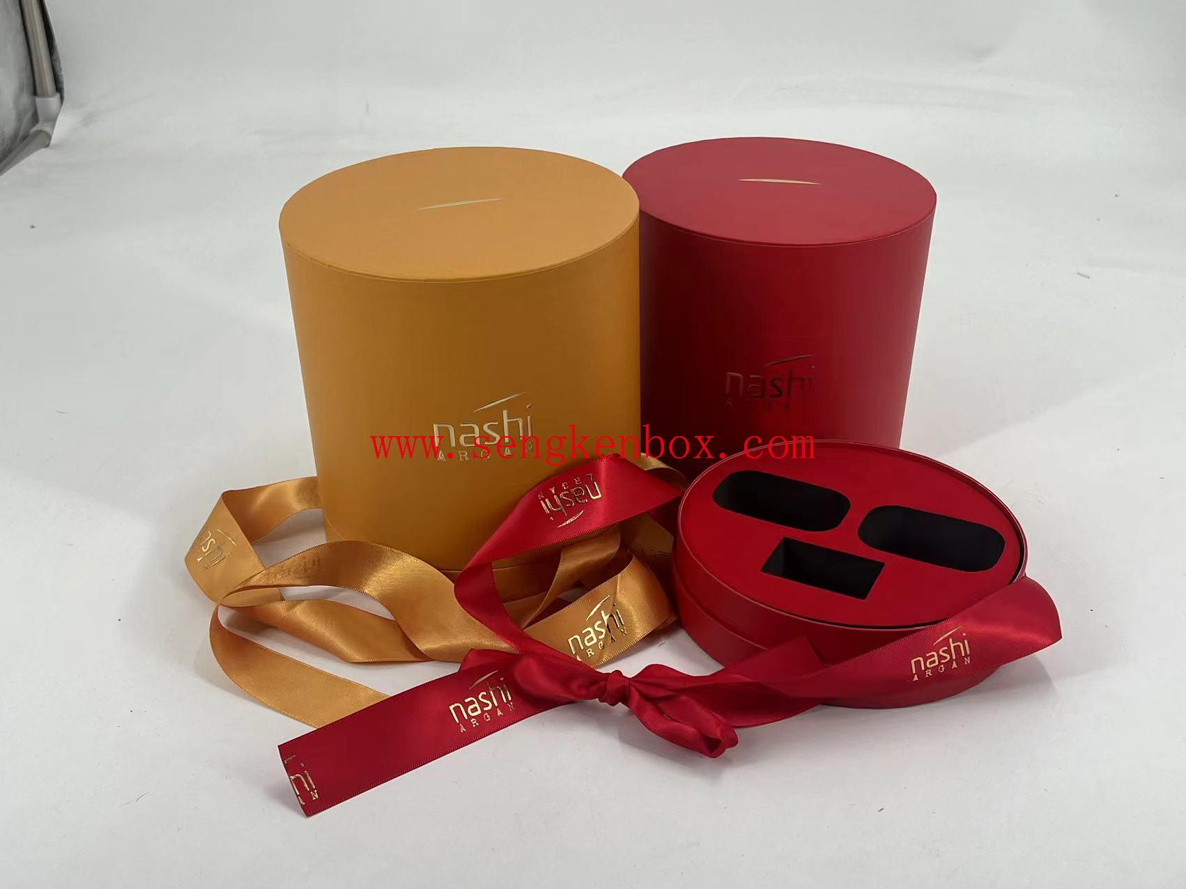 Caja de regalo redonda con cinta de seda